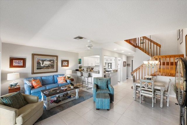 1102 SE Mitchell Ave Unit 302, Port Saint Lucie, FL 34952 - living room featuring ceiling fan, stairway, and light tile patterned flooring
