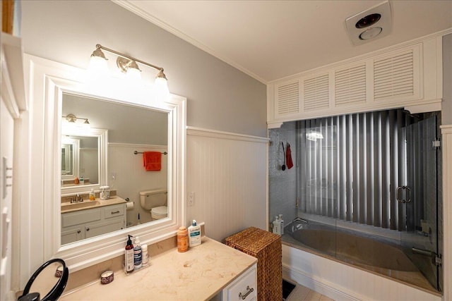 1102 SE Mitchell Ave Unit 302, Port Saint Lucie, FL 34952 - bathroom featuring vanity, tub / shower combination, a wainscoted wall, and ornamental molding