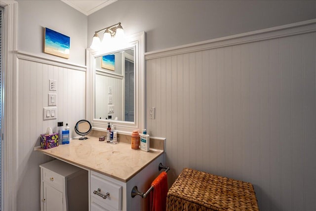 1102 SE Mitchell Ave Unit 302, Port Saint Lucie, FL 34952 - bathroom with wainscoting, ornamental molding, vanity, and a decorative wall