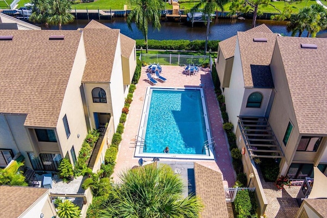 1102 SE Mitchell Ave Unit 302, Port Saint Lucie, FL 34952 - community pool featuring a water view, a patio, and a residential view
