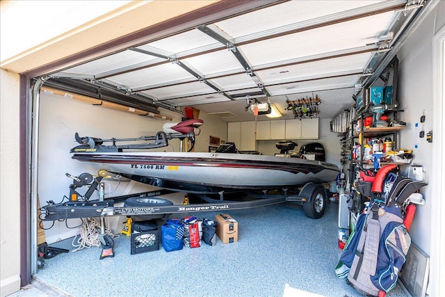 1102 SE Mitchell Ave Unit 302, Port Saint Lucie, FL 34952 - garage featuring a garage door opener