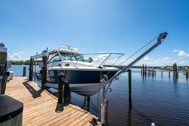 1102 SE Mitchell Ave Unit 302, Port Saint Lucie, FL 34952 - dock area featuring boat lift and a water view