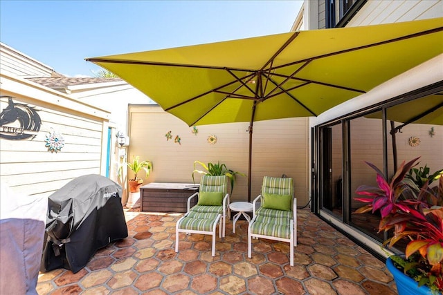 1102 SE Mitchell Ave Unit 302, Port Saint Lucie, FL 34952 - view of patio / terrace featuring grilling area and a jacuzzi