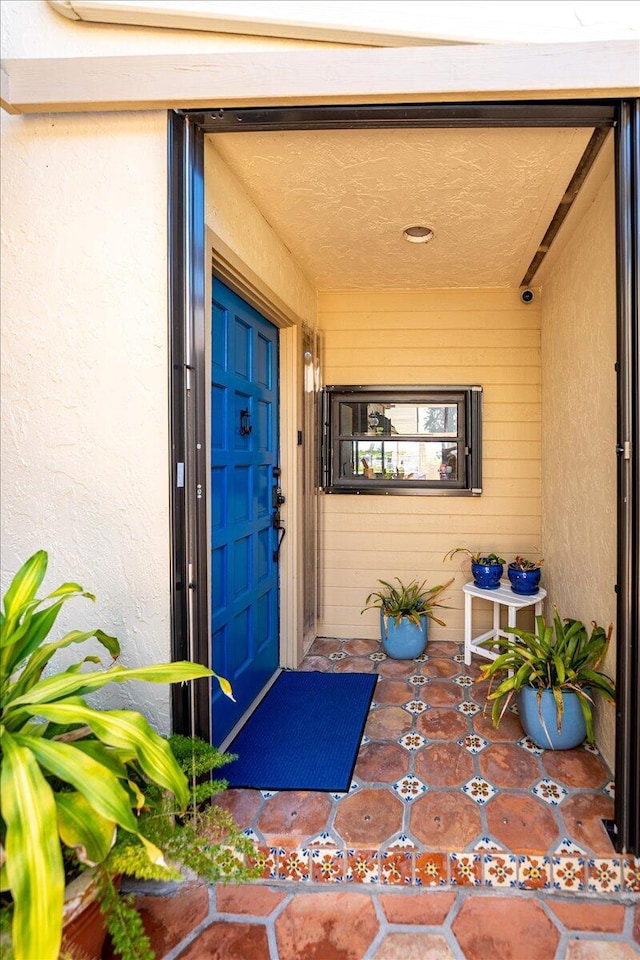 1102 SE Mitchell Ave Unit 302, Port Saint Lucie, FL 34952 - view of exterior entry with stucco siding