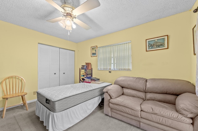 501 Normandy K, Delray Beach, FL 33484 - carpeted bedroom with a closet, a ceiling fan, and a textured ceiling