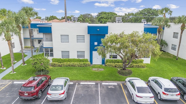 501 Normandy K, Delray Beach, FL 33484 - view of property featuring uncovered parking