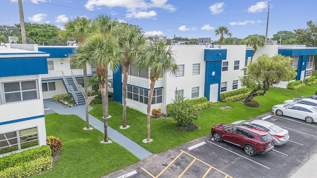 501 Normandy K, Delray Beach, FL 33484 - view of building exterior with uncovered parking