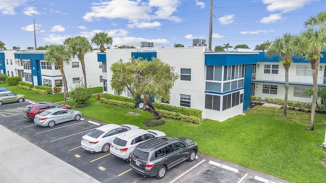 501 Normandy K, Delray Beach, FL 33484 - view of building exterior featuring uncovered parking