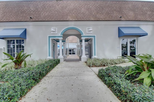 501 Normandy K, Delray Beach, FL 33484 - entrance to property with roof with shingles and stucco siding