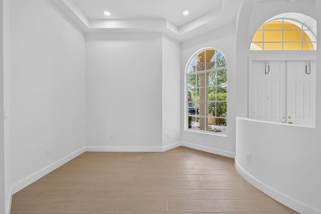 8873 Via Brilliante, Wellington, FL 33411 - entrance foyer with recessed lighting, light wood finished floors, and a raised ceiling