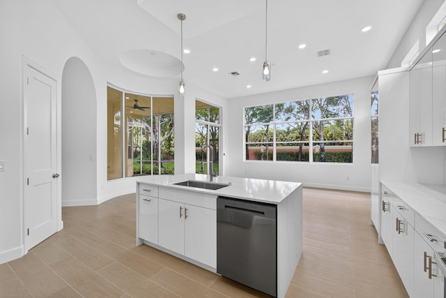 8873 Via Brilliante, Wellington, FL 33411 - kitchen featuring dishwasher, recessed lighting, a ceiling fan, decorative light fixtures, and an island with sink