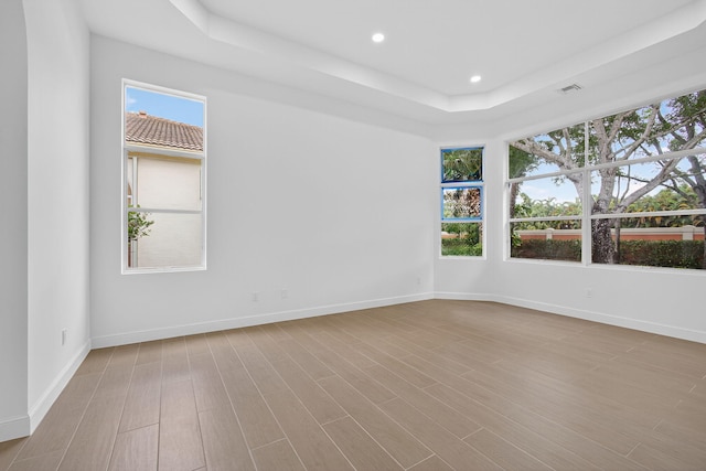 8873 Via Brilliante, Wellington, FL 33411 - spare room with recessed lighting, wood finished floors, and a raised ceiling