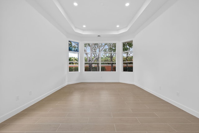 8873 Via Brilliante, Wellington, FL 33411 - unfurnished room with recessed lighting and a tray ceiling