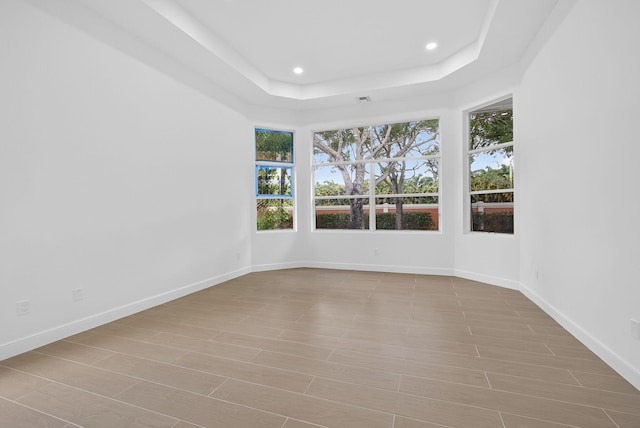 8873 Via Brilliante, Wellington, FL 33411 - unfurnished room featuring recessed lighting and a tray ceiling