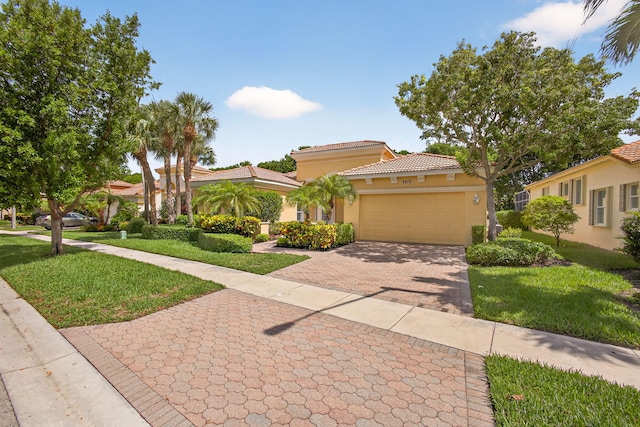 8873 Via Brilliante, Wellington, FL 33411 - mediterranean / spanish-style house featuring stucco siding, a front lawn, decorative driveway, and a tiled roof