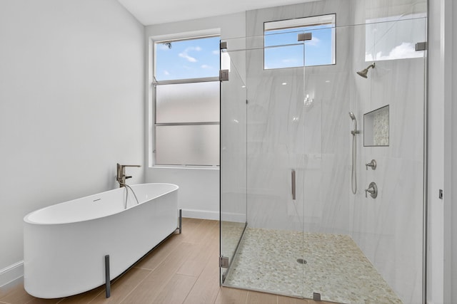 8873 Via Brilliante, Wellington, FL 33411 - full bath featuring a stall shower, healthy amount of natural light, and a freestanding bath