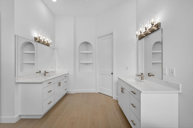 8873 Via Brilliante, Wellington, FL 33411 - full bathroom featuring built in features, two vanities, and wood finished floors