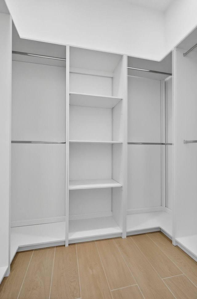 8873 Via Brilliante, Wellington, FL 33411 - walk in closet featuring wood finished floors