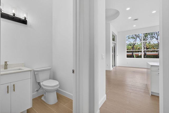 8873 Via Brilliante, Wellington, FL 33411 - bathroom featuring vanity, recessed lighting, and wood finished floors