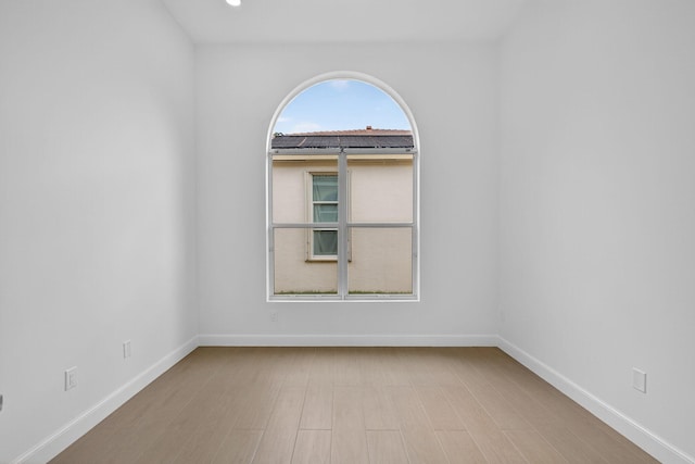 8873 Via Brilliante, Wellington, FL 33411 - empty room featuring baseboards and wood finished floors