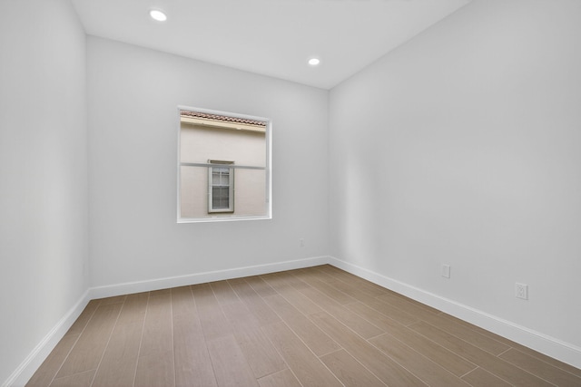 8873 Via Brilliante, Wellington, FL 33411 - empty room featuring wood finished floors and recessed lighting