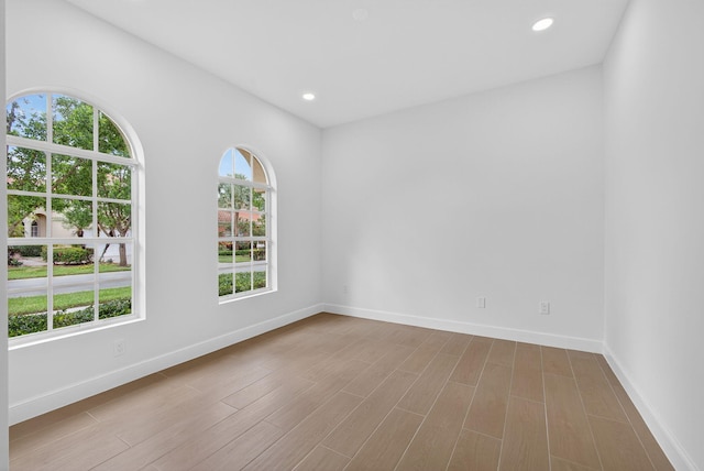 8873 Via Brilliante, Wellington, FL 33411 - unfurnished room featuring wood finished floors and recessed lighting