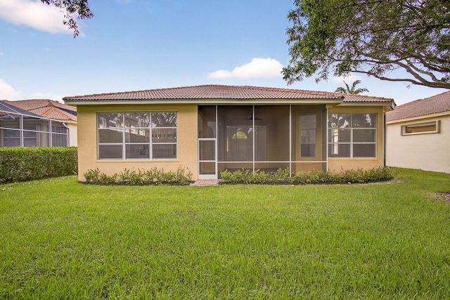8873 Via Brilliante, Wellington, FL 33411 - back of house featuring stucco siding, a tile roof, and a lawn