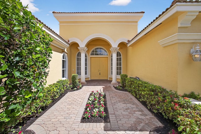8873 Via Brilliante, Wellington, FL 33411 - property entrance featuring stucco siding and a tiled roof