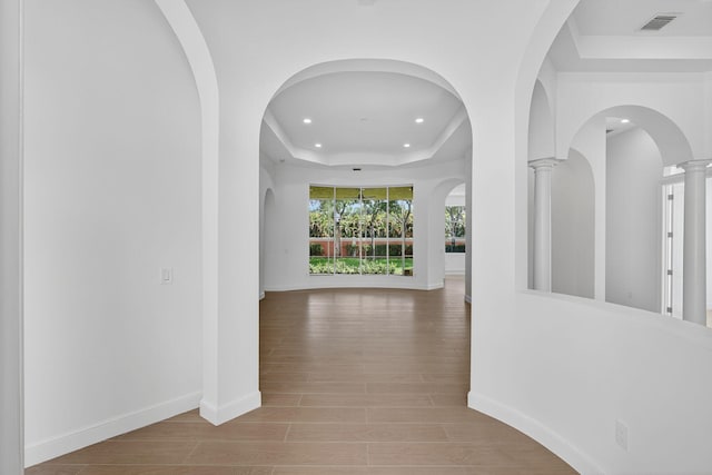 8873 Via Brilliante, Wellington, FL 33411 - corridor with a tray ceiling, recessed lighting, and wood finished floors