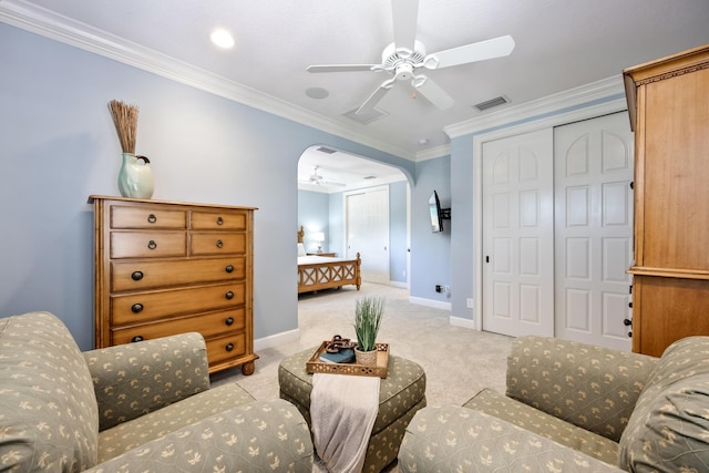 671 Indian River Dr, Melbourne, FL 32935 - carpeted bedroom with a closet, crown molding, a ceiling fan, and arched walkways