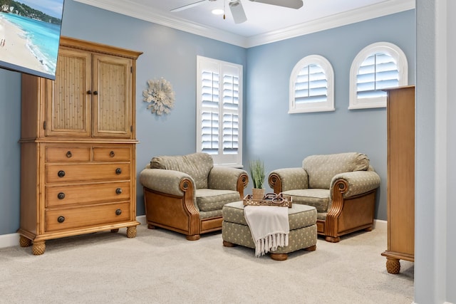 671 Indian River Dr, Melbourne, FL 32935 - living area with ceiling fan, ornamental molding, and light carpet