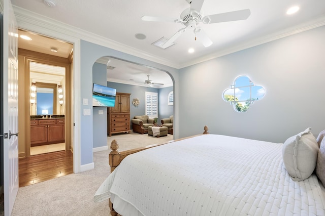 671 Indian River Dr, Melbourne, FL 32935 - carpeted bedroom featuring arched walkways, a ceiling fan, and ornamental molding
