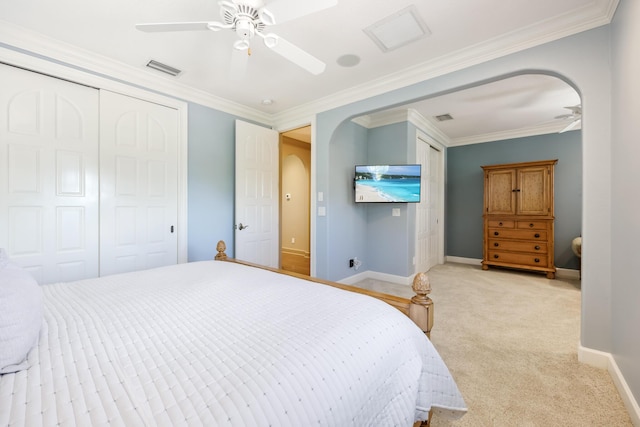 671 Indian River Dr, Melbourne, FL 32935 - bedroom featuring light carpet, arched walkways, a ceiling fan, and ornamental molding