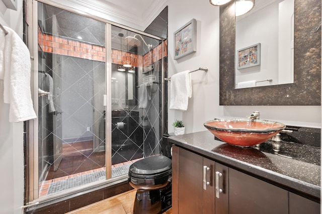 671 Indian River Dr, Melbourne, FL 32935 - bathroom featuring vanity, a stall shower, and ornamental molding