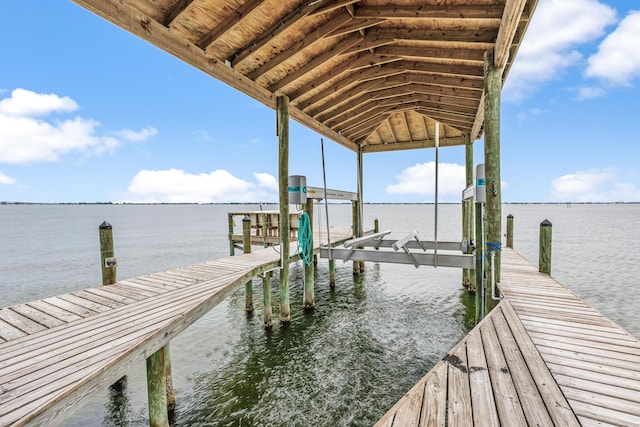 671 Indian River Dr, Melbourne, FL 32935 - dock area featuring boat lift and a water view