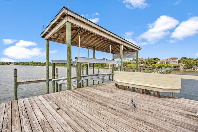 671 Indian River Dr, Melbourne, FL 32935 - dock featuring boat lift and a water view