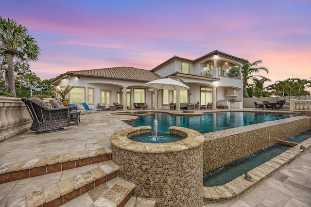671 Indian River Dr, Melbourne, FL 32935 - outdoor pool featuring a patio area, an outdoor hangout area, exterior kitchen, and outdoor dining space