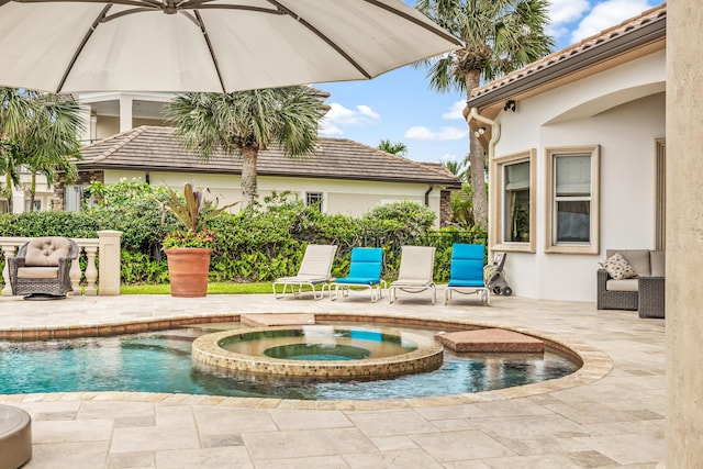 671 Indian River Dr, Melbourne, FL 32935 - view of swimming pool with a patio area and a pool with connected hot tub