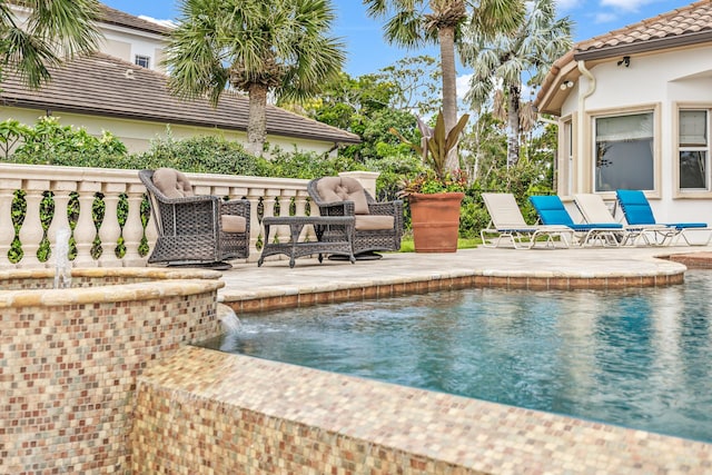 671 Indian River Dr, Melbourne, FL 32935 - view of swimming pool featuring a patio area and a pool with connected hot tub