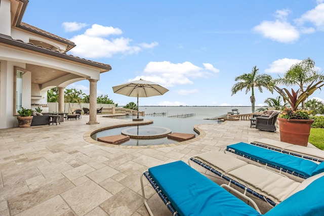 671 Indian River Dr, Melbourne, FL 32935 - view of pool with a patio, an outdoor hangout area, a water view, and outdoor dining space