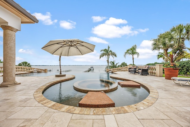 671 Indian River Dr, Melbourne, FL 32935 - surrounding community with a hot tub, a patio area, a water view, and a swimming pool