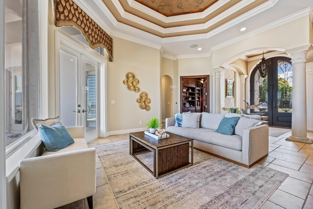 671 Indian River Dr, Melbourne, FL 32935 - living area featuring arched walkways, french doors, ornate columns, crown molding, and recessed lighting