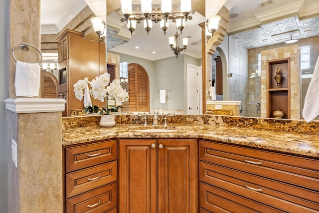 671 Indian River Dr, Melbourne, FL 32935 - full bathroom with ornamental molding, vanity, a tile shower, and a chandelier