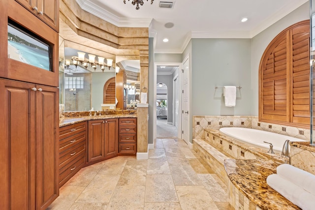 671 Indian River Dr, Melbourne, FL 32935 - full bath featuring plenty of natural light, vanity, a garden tub, crown molding, and tiled shower