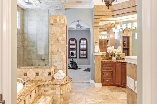 671 Indian River Dr, Melbourne, FL 32935 - bathroom featuring vanity, crown molding, a tile shower, a ceiling fan, and a tub