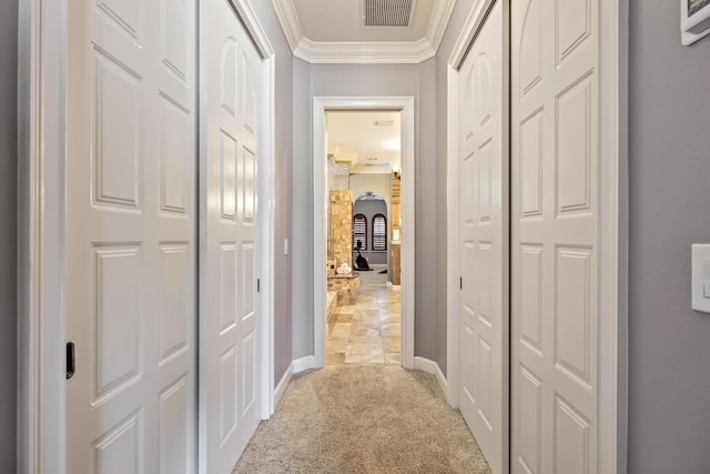671 Indian River Dr, Melbourne, FL 32935 - hallway with light colored carpet and ornamental molding
