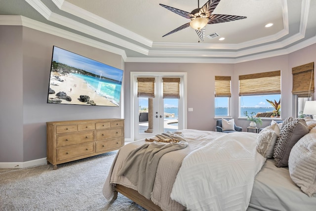 671 Indian River Dr, Melbourne, FL 32935 - bedroom featuring a raised ceiling, crown molding, access to outside, french doors, and light colored carpet
