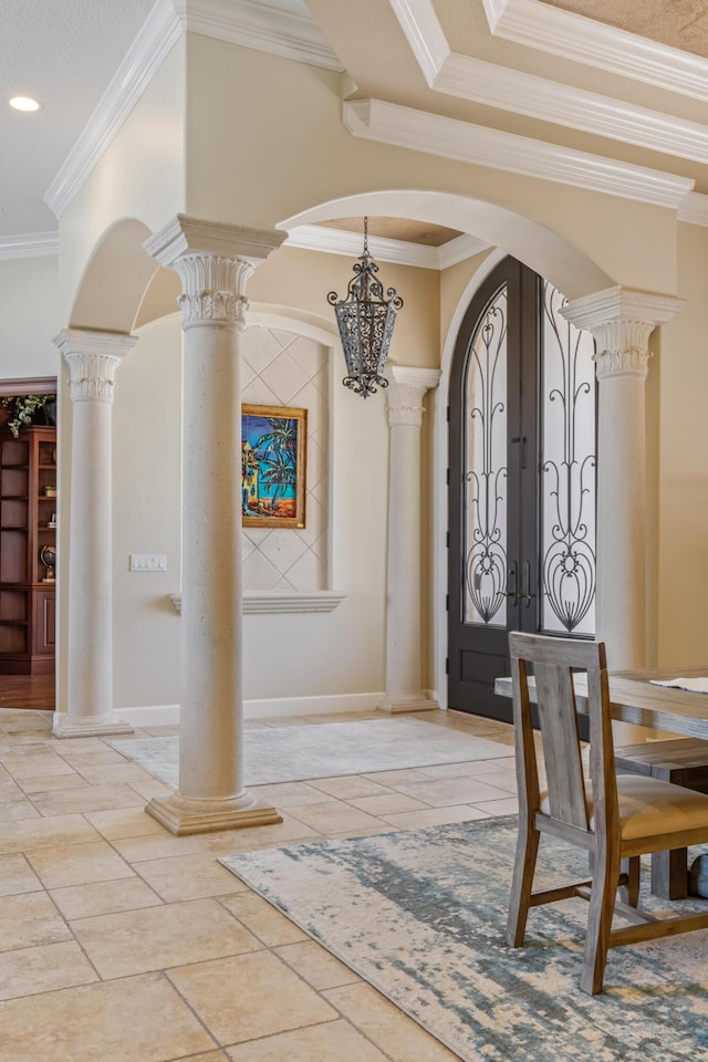 671 Indian River Dr, Melbourne, FL 32935 - entryway featuring arched walkways, ornate columns, ornamental molding, a chandelier, and french doors