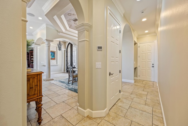671 Indian River Dr, Melbourne, FL 32935 - corridor featuring ornamental molding, arched walkways, ornate columns, recessed lighting, and stone tile floors