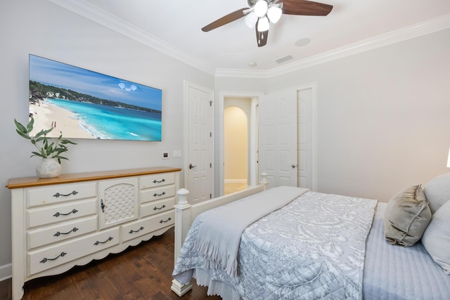 671 Indian River Dr, Melbourne, FL 32935 - bedroom with crown molding, dark wood-style flooring, ceiling fan, and arched walkways